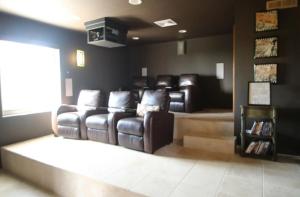 a waiting room with leather reclining chairs in a salon at Spectacular views in Long Path
