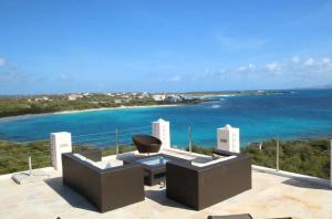 a view of the ocean from a building with a chair at Spectacular views in Long Path
