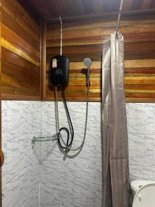 a shower in a bathroom with a shower at Lamphu Resort Koh Lanta at Lanta Old Town in Ko Lanta