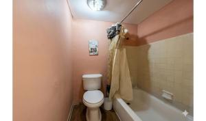 a bathroom with a toilet and a bath tub at Anhinga Motel Homestead FL in Homestead +17 photos