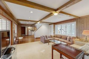 a living room with a couch and a table at La Casa De La Playa in Gloucester