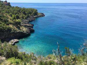 a view of the ocean from a cliff at Intera casa con giardino, vista mare e montagna in Maratea