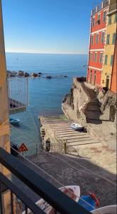a view of the ocean from a balcony at Life Class Apartment in Riomaggiore