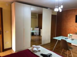 a living room with a large mirror and a table at Via Gagliardi - Centro in Vibo Valentia