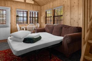 a living room with a couch and a table at Sun Outdoors Canyonlands Gateway in Moab +48 photos