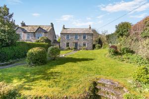 an old stone house with a green yard at 4 Bed in St. Mawgan oc-p00610 in Saint Mawgan
