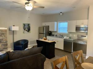 a kitchen with a couch and a table in a room at Valhalla Resort Hotel in Helen