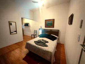 a bedroom with a bed in a room at Casa Caminho do Meio in Rio de Janeiro +42 photos