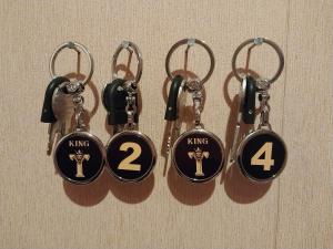 a group of four key hooks with the number four at KING City Center Hostel in Baku
