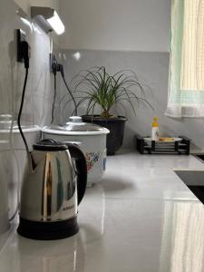 a kitchen counter with a toaster and a tea pot at Casa Meraki in Dickwella