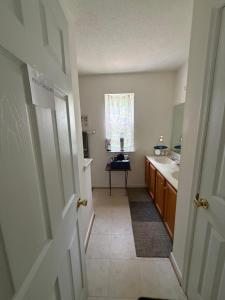 a small bathroom with a sink and a window at Wonderful room in great neighborhood near Downtown in Richmond