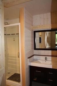 a bathroom with a sink and a shower at les pins in Quend