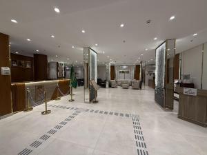 a large room with a lobby with a store at Retaj Al Noor Hotel, فندق ريتاج النور in Medina