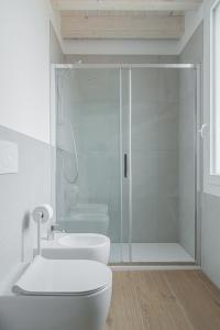 a bathroom with a shower and a toilet and a sink at LaVero Maison in Castelfranco Emilia