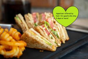 a group of sandwiches on a plate with fries at Room country-lake in Dormelletto +20 photos