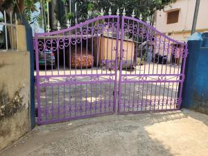 a purple gate in front of a building at The Fortune Mango in Jajpur Road