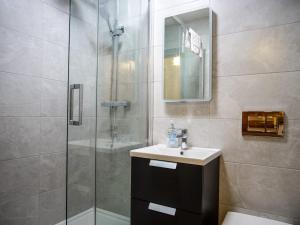 a bathroom with a sink and a shower at Central Dingle Stay in Dingle +36 photos