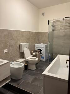 a bathroom with a toilet and a sink and a shower at Dayana House in Gallipoli +15 photos