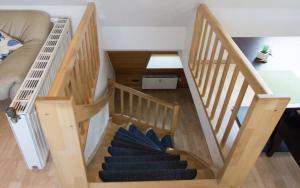 a set of stairs in a living room at Luv Lee Duhnen 09 in Cuxhaven