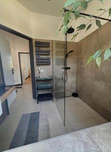 a bathroom with a shower with a tree painted on the ceiling at Casa Roberto, Apartment 1 in Mariazell
