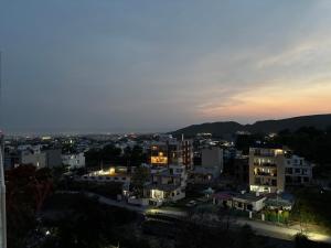 a view of a city at night at The Bloomhouse inn in Rājpur