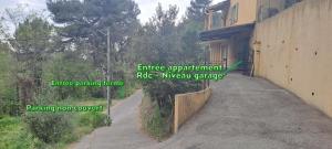 an empty road next to a building with the words entrance appointment role new at Studio calme proche de Nice in Colomars +9 photos