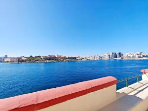 a view of a large body of water with buildings at Dar Marija in Valletta