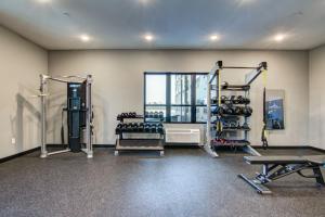a room with a gym with equipment and a window at Fairway in Altoona