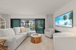 a living room with a couch and a table at Mariner Pointe #521 in Sanibel