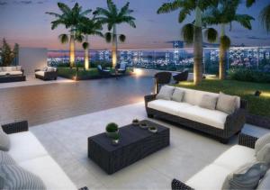 a living room with couches and palm trees at Metropolitan Sidney in Goiânia