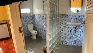 a bathroom with a toilet and a sink at Elephant garden2 in Trat +86 photos