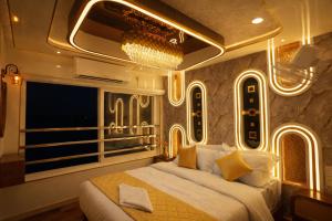 a bedroom with a bed and a large window at Best Homestay in Alappuzha 4 BR- LAYANILA in Alleppey +119 photos
