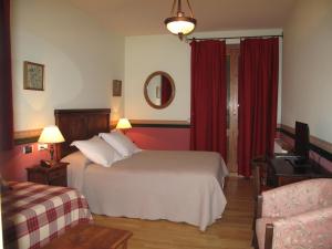 Säng eller sängar i ett rum på Hotel Casa Anita
