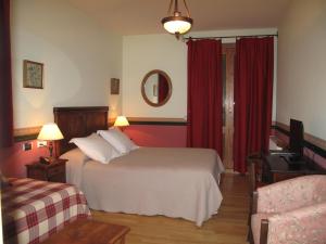 Postel nebo postele na pokoji v ubytování Hotel Casa Anita