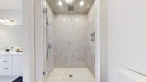 a white bathroom with a shower and a sink at Modern-Detached 5 Bedroom100 Spotless-Sleeps 13 in Caledon East +43 photos