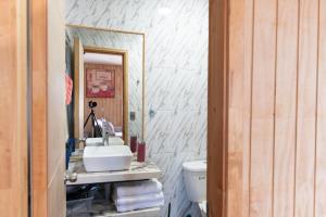 a bathroom with a sink and a toilet at Cabañas Rosner in Valdivia +48 photos