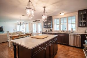 a kitchen with a large island in the middle at Lake Views & Fire Pit in South Haven