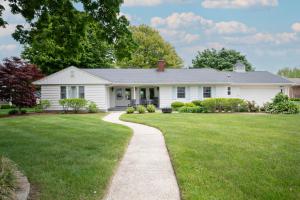 a white house with a lawn and a sidewalk at Lake Views & Fire Pit in South Haven