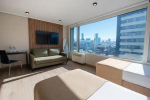 a hotel room with a view of a city at Hotel Terrado Lyon in Santiago