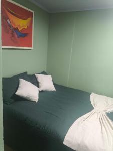 a bedroom with a bed with two pillows on it at Espaço Vip in Brasília