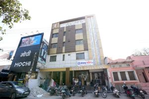 a group of motorcycles parked in front of a building at Staykart Lotus in Bhilwara