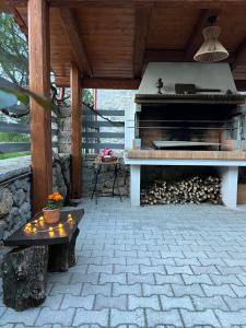 an outdoor patio with a piano and a table at Alonaki House in Amfikleia