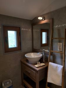 a bathroom with a sink and a mirror at Casa Stella in Olmeto