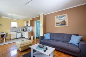 a living room with a couch and a table at Charlie&Blueberries 1 in Belgrade