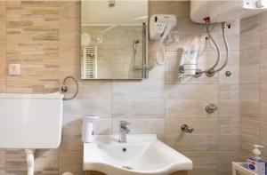 a bathroom with a sink and a mirror at Charlie&Blueberries 1 in Belgrade +74 photos