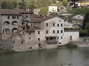 a group of buildings next to a river at Le Terrazze sul Fiume in Santa Sofia