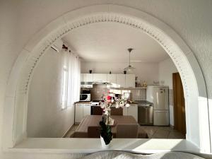an archway in a living room with a kitchen at Guest House Angela in Senj