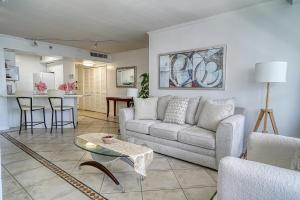 a living room with a couch and a table at Oceanview Apartment on the beach 123 in Miami Beach