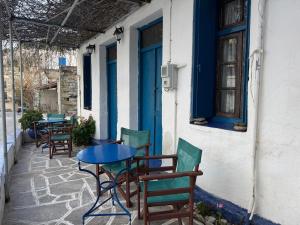 a table and chairs sitting outside of a building at Anthemis home II in Agios Kirykos