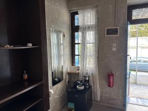 a room with a door and a window at Anthemis home II in Agios Kirykos
